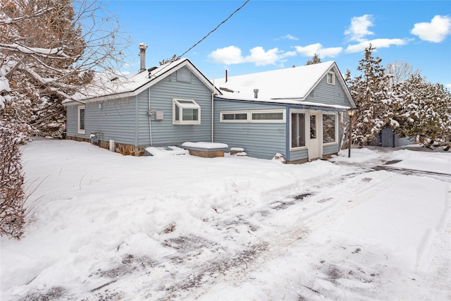 view of snow covered property