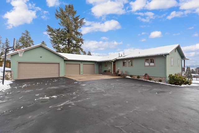 ranch-style house featuring a garage