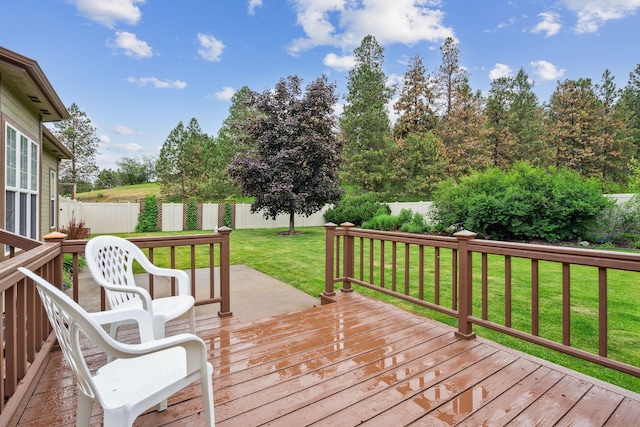 wooden deck with a lawn