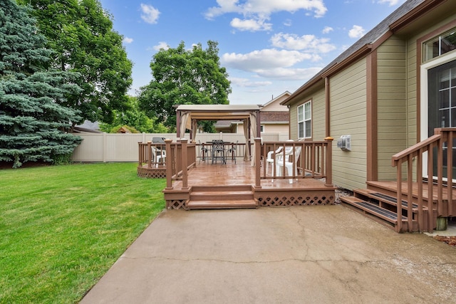 wooden terrace with a lawn