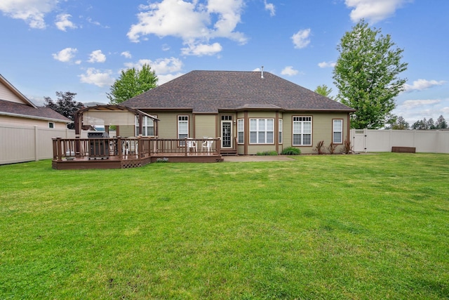 rear view of house featuring a lawn, a pergola, and a deck