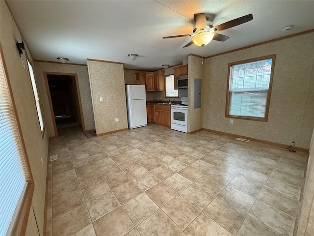 kitchen featuring ceiling fan, white appliances, and crown molding