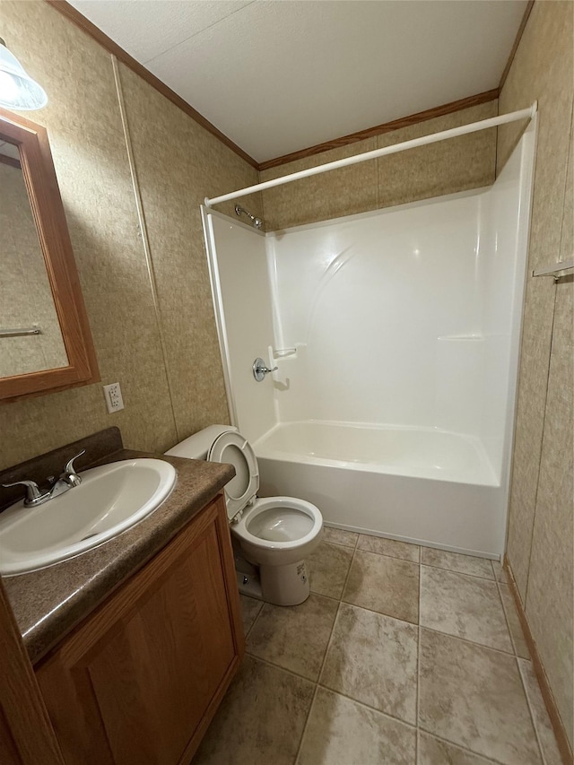 full bathroom with shower / bathing tub combination, vanity, toilet, and crown molding