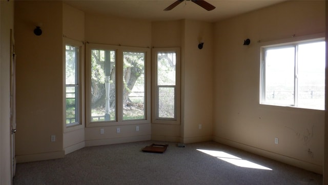 carpeted empty room with ceiling fan