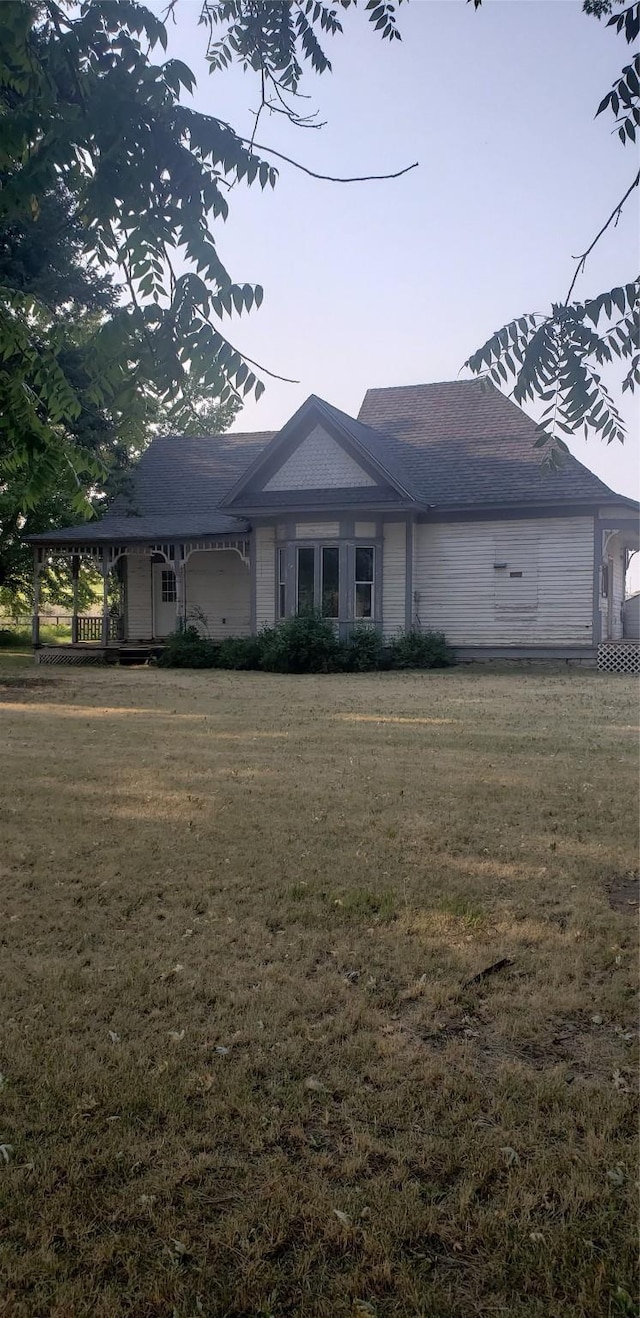 single story home featuring a garage and a front lawn