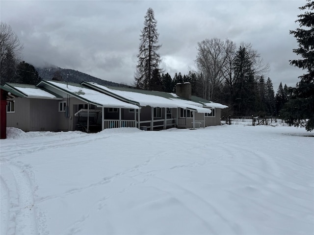 view of snow covered house