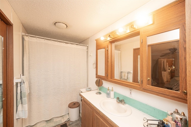 bathroom featuring vanity and a textured ceiling