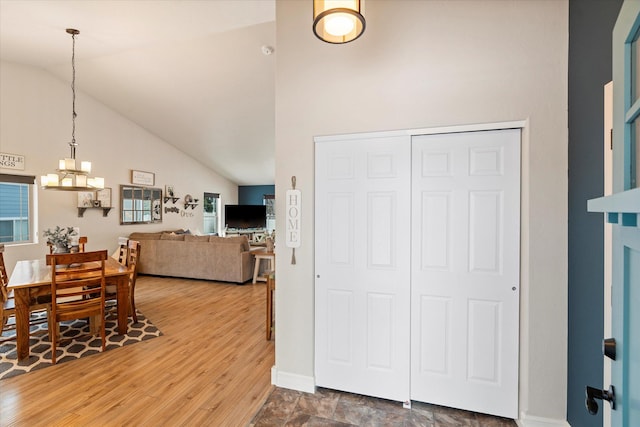 interior space featuring high vaulted ceiling and wood-type flooring