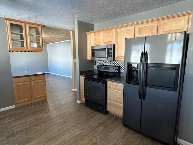 kitchen featuring decorative backsplash, dark wood-type flooring, and appliances with stainless steel finishes