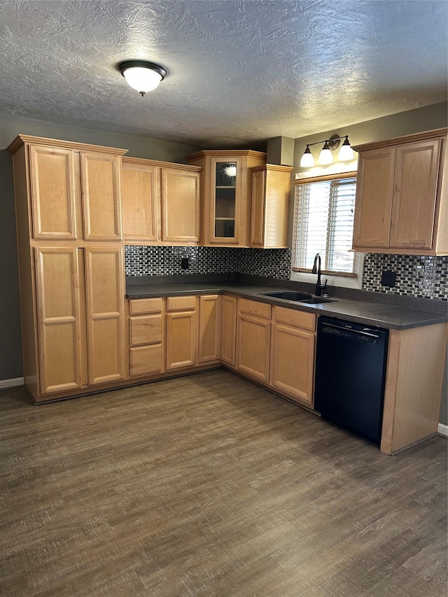 kitchen with dishwasher, a textured ceiling, dark hardwood / wood-style floors, and sink