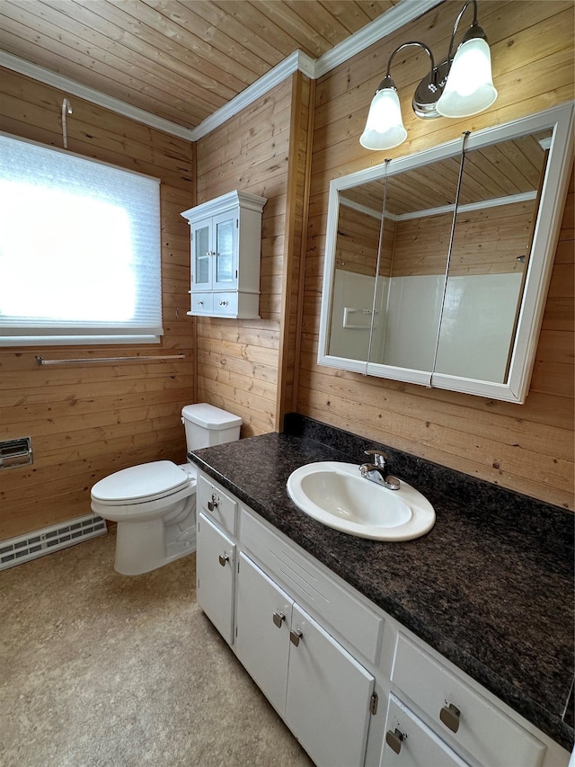 bathroom featuring vanity, crown molding, a baseboard heating unit, and wood walls