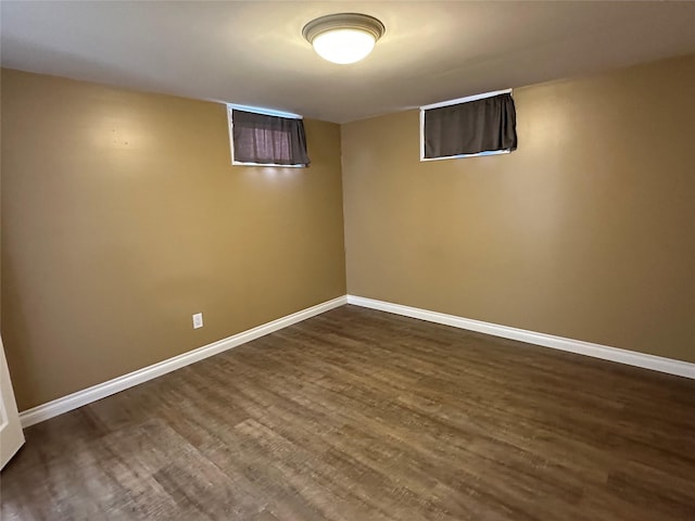 basement with dark wood-type flooring