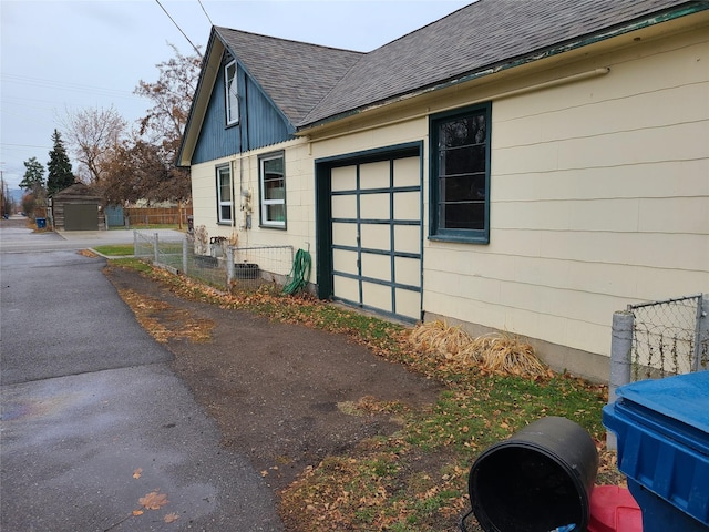 view of side of home with a garage