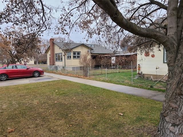 view of side of home featuring a yard