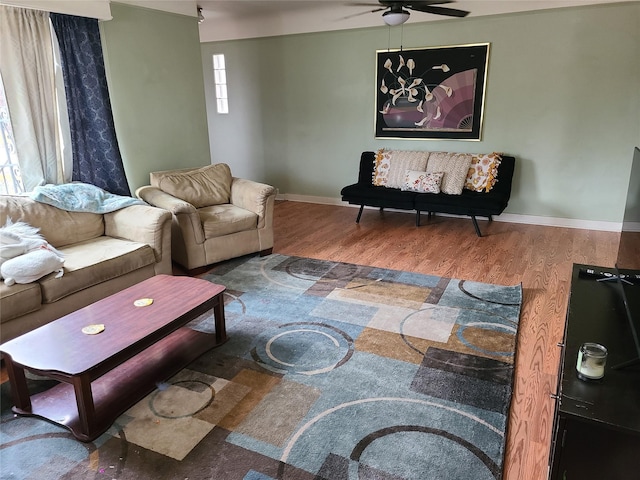 living room with hardwood / wood-style floors and ceiling fan