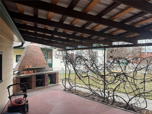 view of patio featuring exterior fireplace