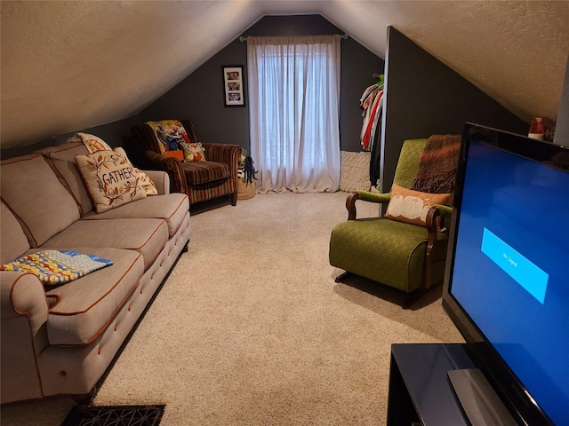 carpeted living room featuring a textured ceiling and vaulted ceiling