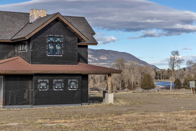 view of side of property featuring a mountain view