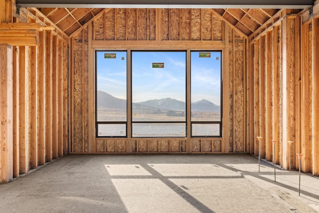 empty room with a mountain view and plenty of natural light