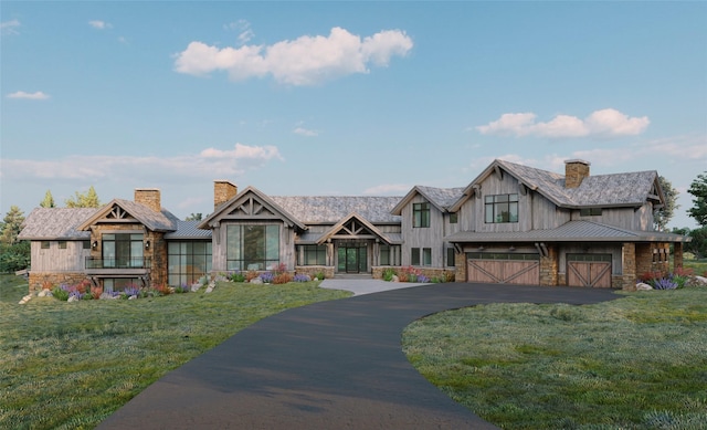 view of front of home with a front lawn and a garage