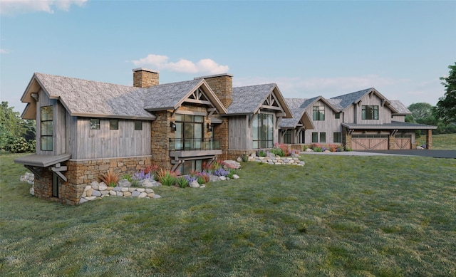 view of front of house featuring a garage and a front lawn