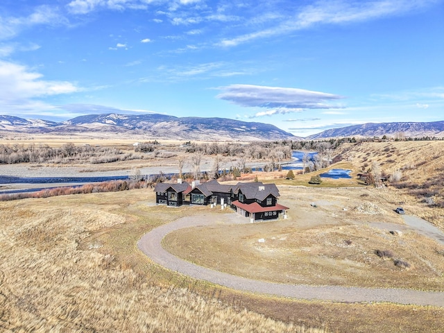 birds eye view of property with a mountain view