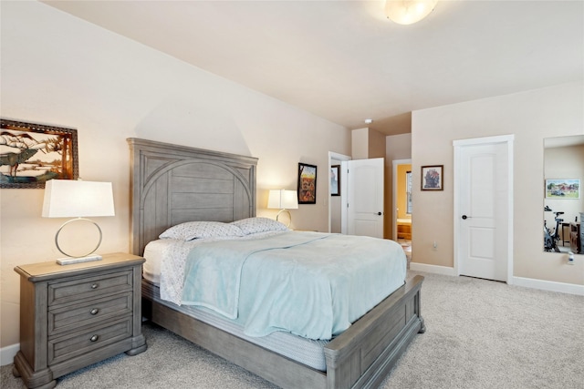 bedroom featuring light colored carpet