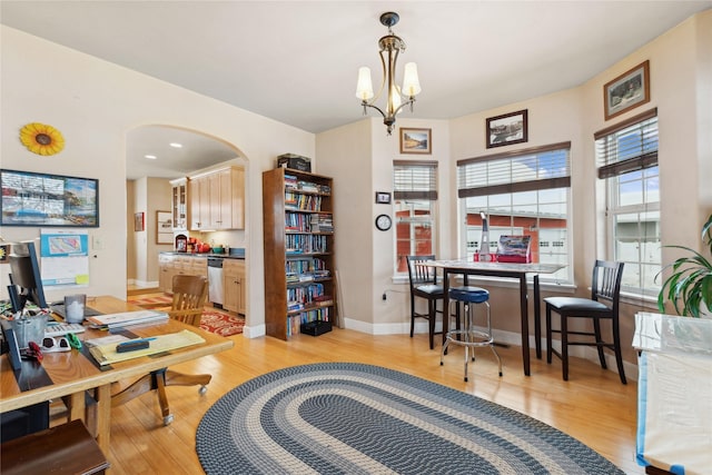 office area with a notable chandelier and light hardwood / wood-style flooring