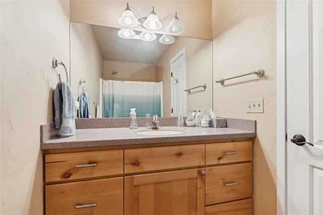 bathroom featuring vanity and a shower with shower curtain