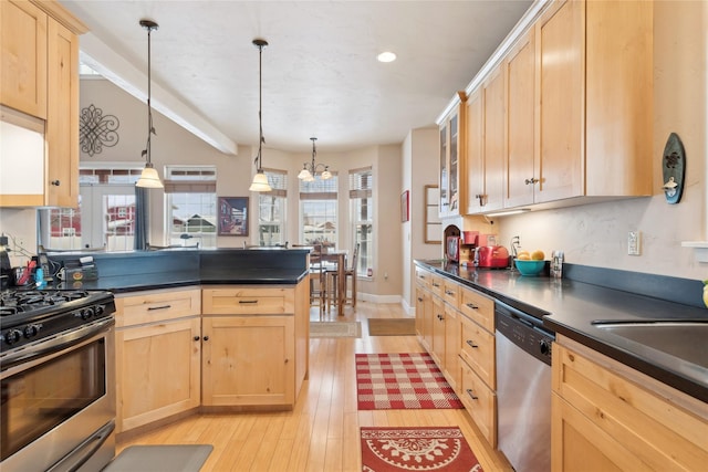 kitchen with light brown cabinetry, stainless steel appliances, decorative light fixtures, light hardwood / wood-style flooring, and a chandelier