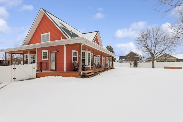 view of snow covered exterior with covered porch