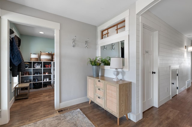 corridor with dark hardwood / wood-style floors