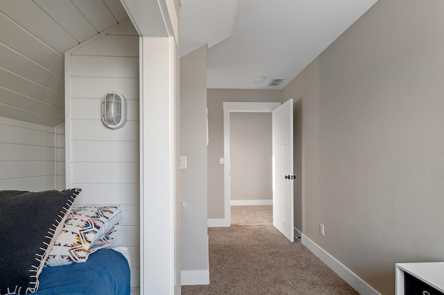 bedroom featuring carpet floors and lofted ceiling