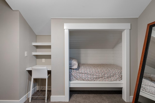 carpeted bedroom with a baseboard radiator