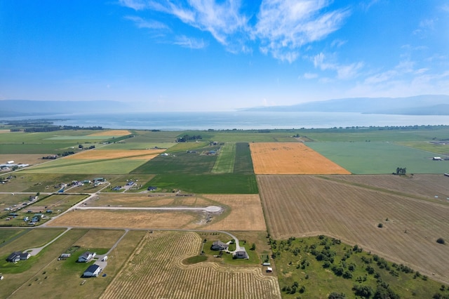 aerial view with a rural view and a water and mountain view