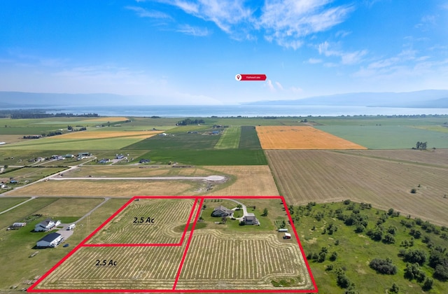 birds eye view of property featuring a rural view