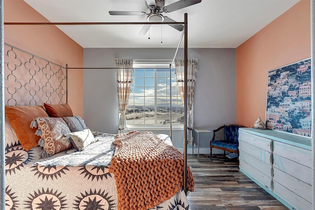 bedroom with ceiling fan and dark wood-type flooring