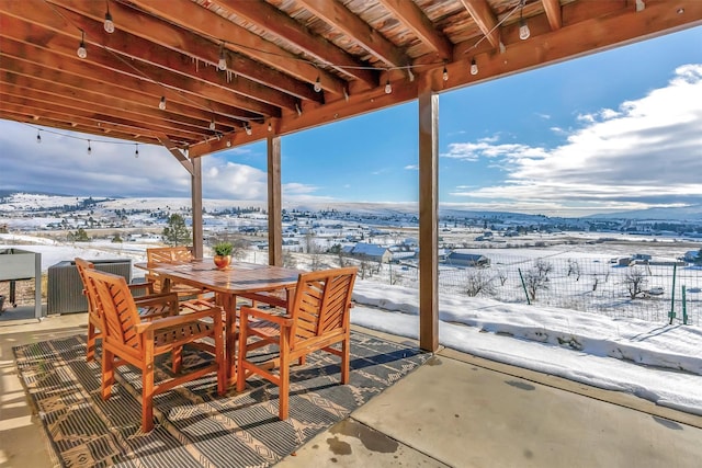 view of snow covered patio