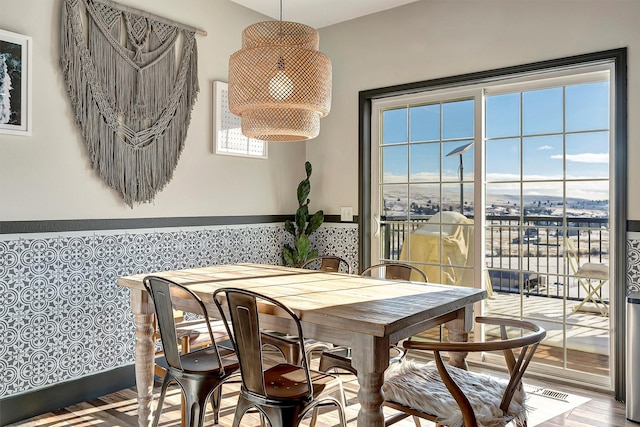 dining space with light wood-type flooring