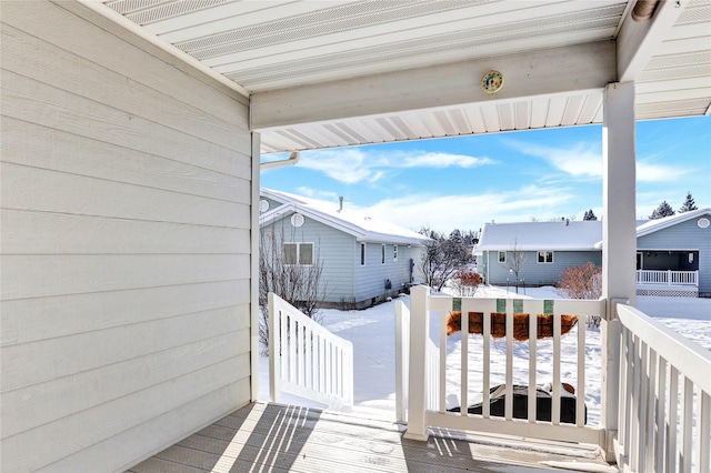 view of snow covered deck