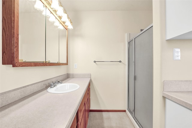 bathroom with vanity and an enclosed shower