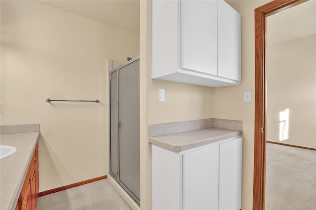 bathroom with vanity and an enclosed shower