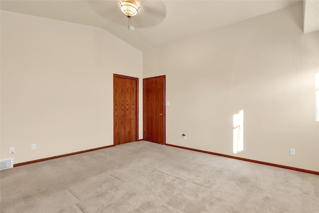 unfurnished room with light carpet, ceiling fan, and lofted ceiling