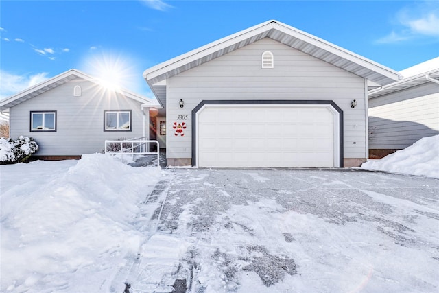 single story home with a garage