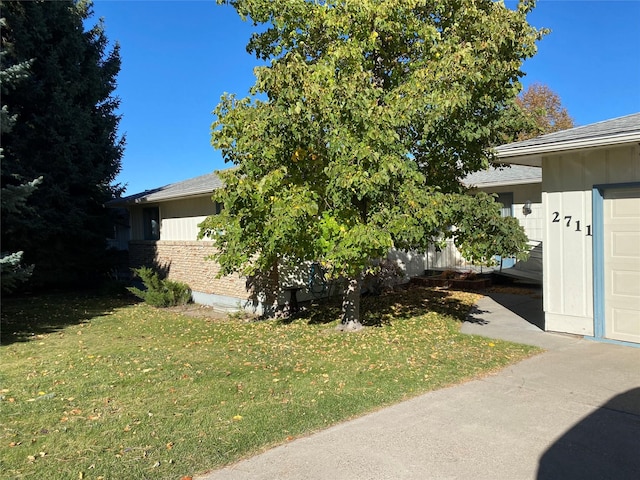 view of property exterior with a yard