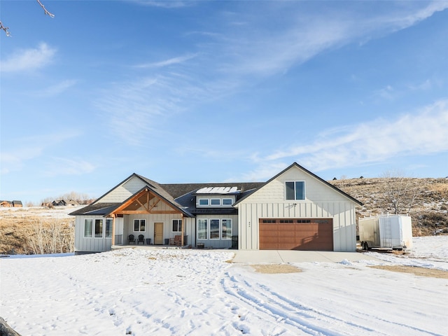 modern inspired farmhouse featuring a garage