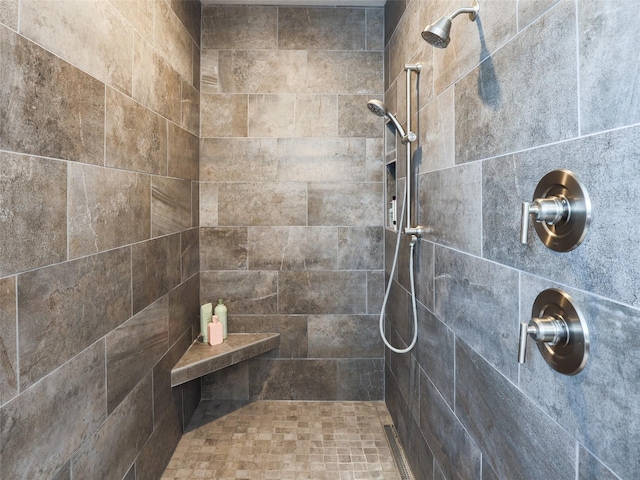 bathroom featuring a tile shower