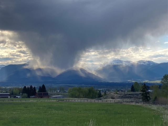 view of mountain feature with a rural view