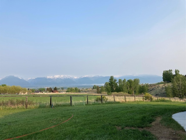 view of yard featuring a rural view and a mountain view