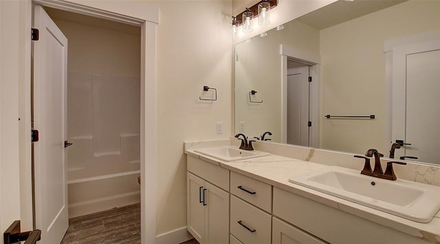 bathroom featuring hardwood / wood-style flooring and vanity